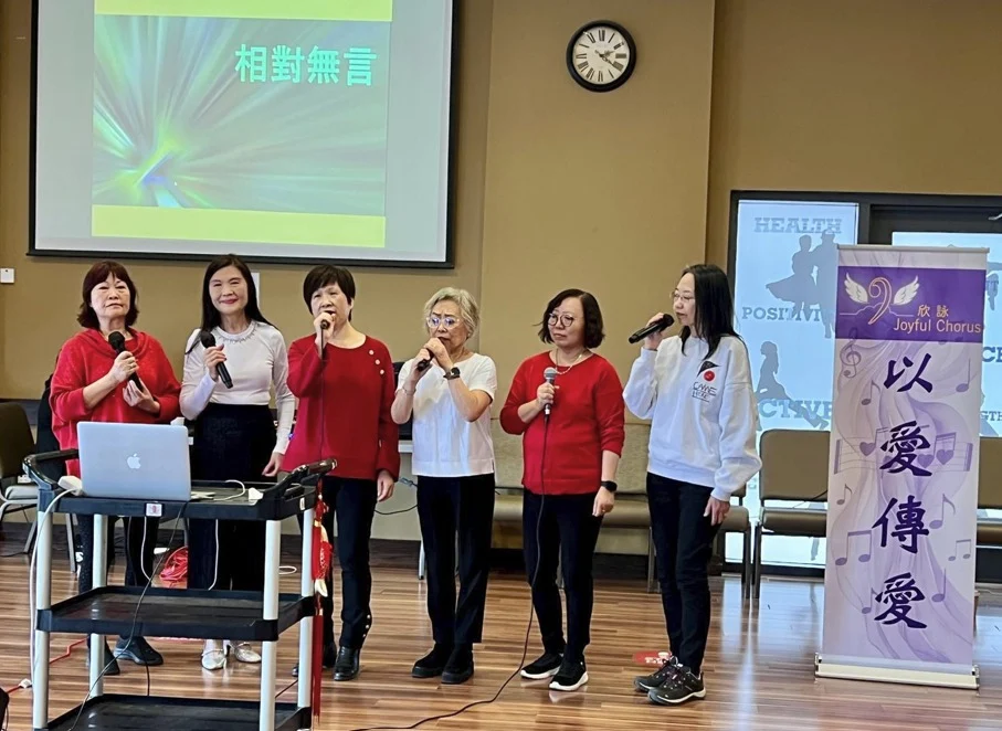 Joyful Chorus members sharing a song